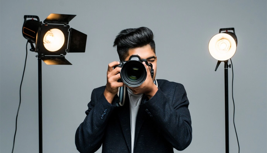 man holding dslr camera
